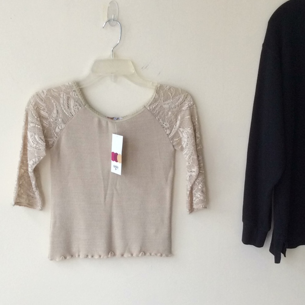 Ogo tan shirt size small.
